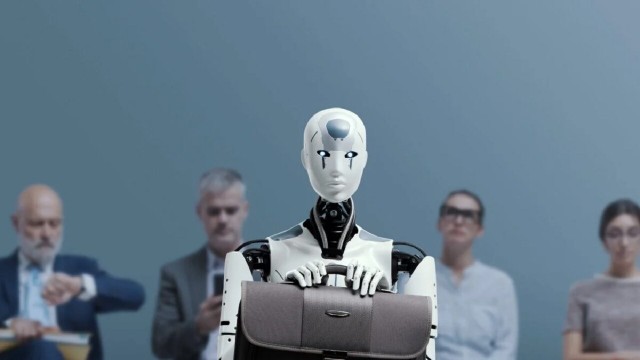 Personas trabajando con inteligencia artificial en una oficina moderna